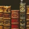 seven hardbound books on black surface stockpack unsplash scaled