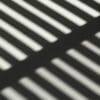 the shadow of a bench on the ground stockpack unsplash scaled