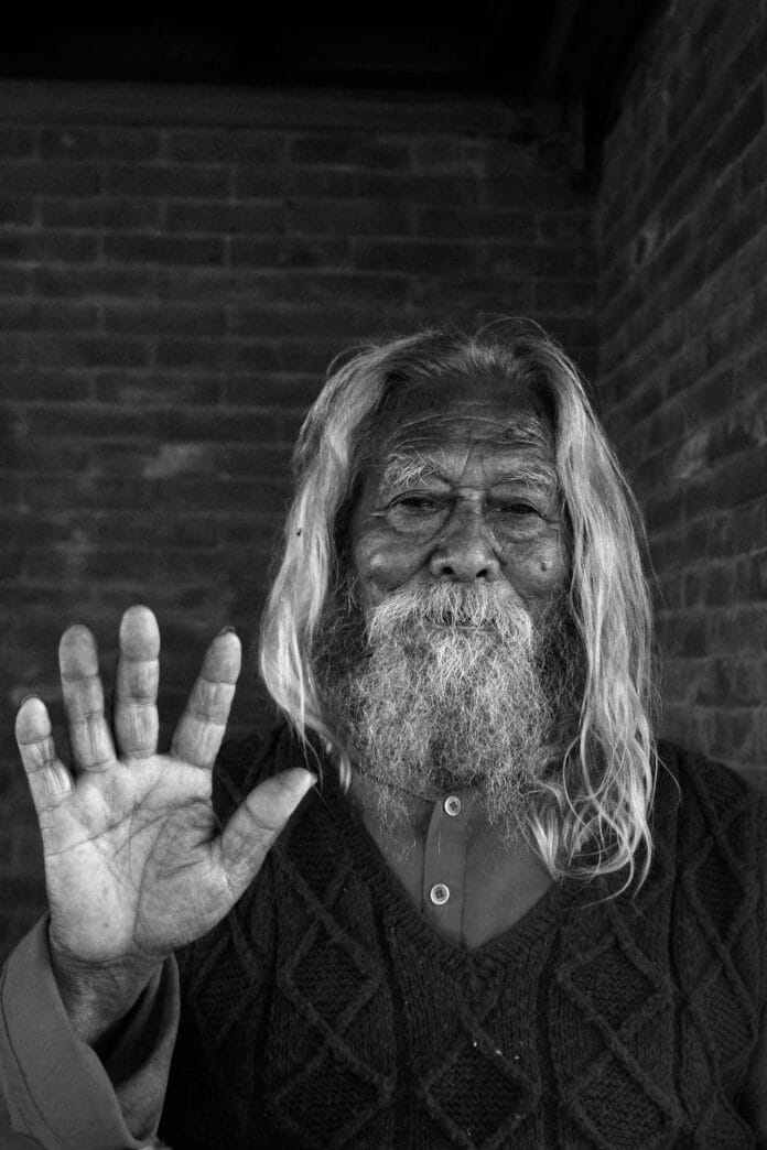 elderly-man-showing-hand-gesture-in-nepal-stockpack-pexels Elderly man showing hand gesture in nepal