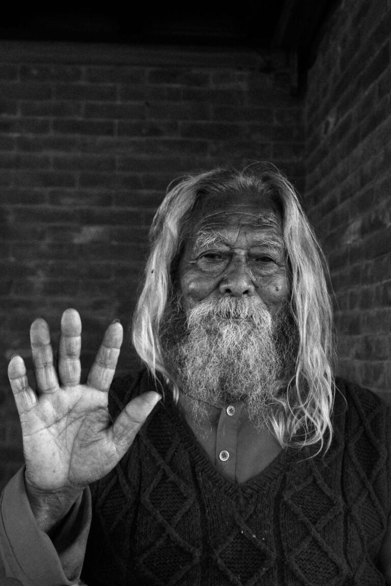 elderly man showing hand gesture in nepal stockpack pexels