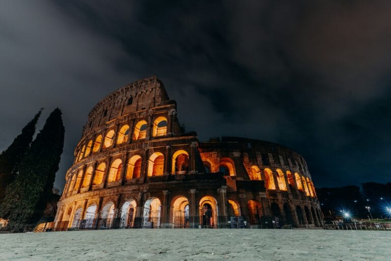 a night time picture of the colossion in rome stockpack unsplash