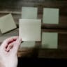 a hand holding a piece of paper stockpack unsplash