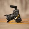 a camera with a yellow cord attached to it stockpack unsplash
