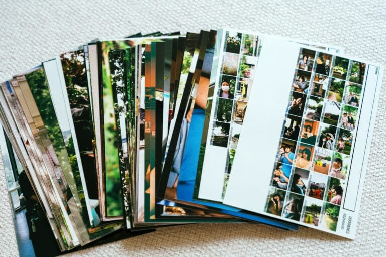Il Formato ORF 10 a stack of printed photographs fanned out stockpack unsplash