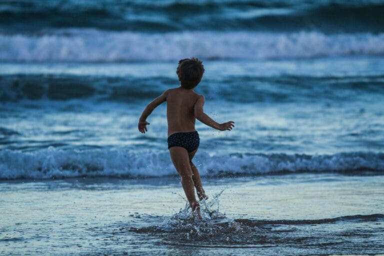 La magic hour 4 boy running towards seashore stockpack unsplash