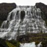 waterfall down a rock mountain stockpack unsplash